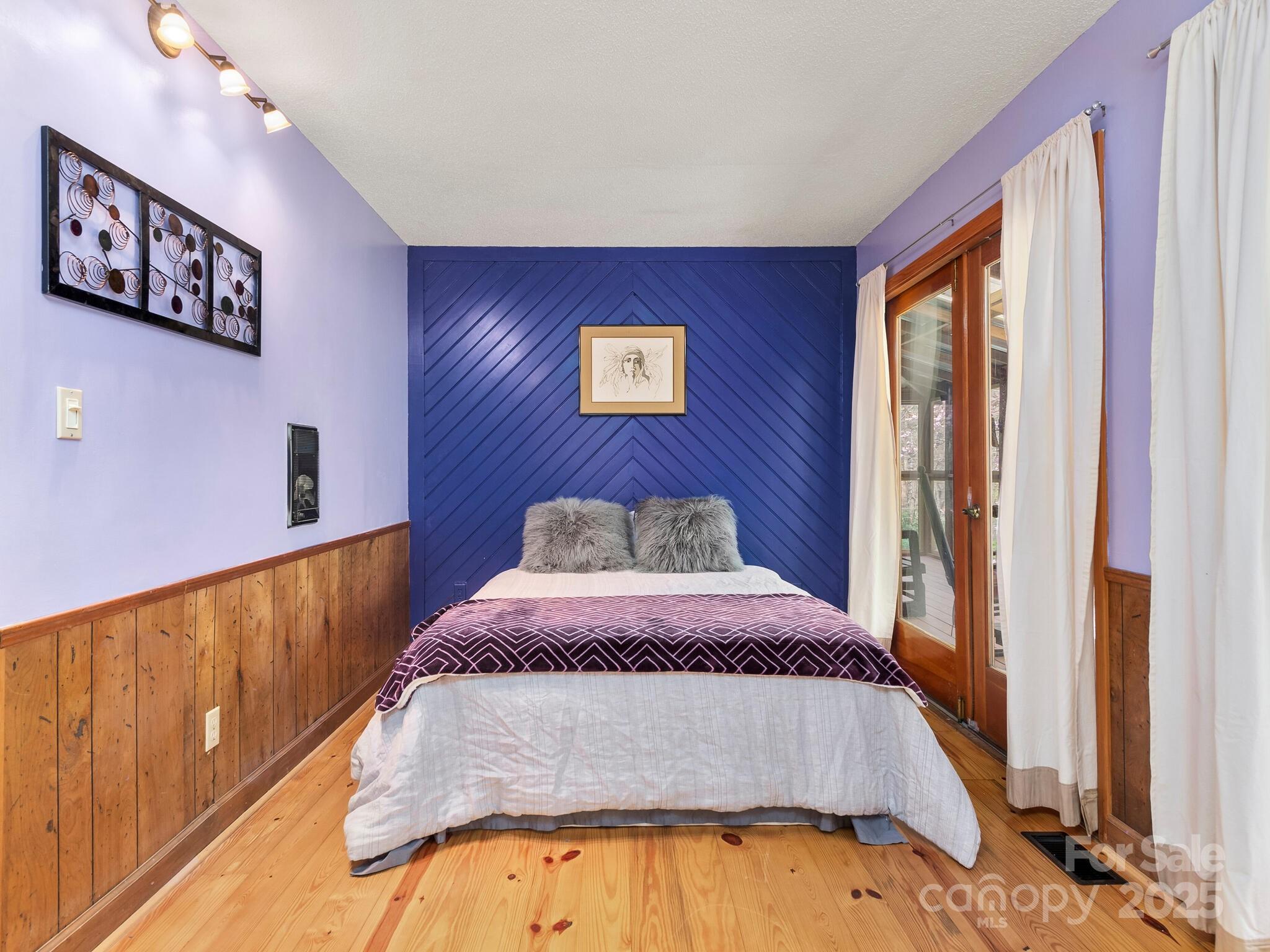 70 Fox Run Hot Springs, NC 28743 - Photo 14 of 29 a bed sitting in a bedroom next to a window