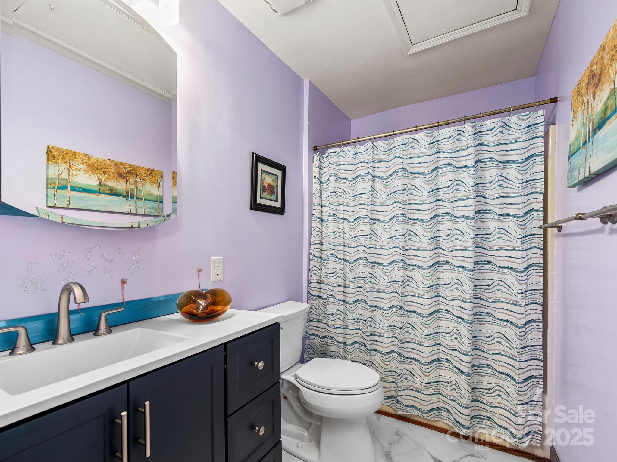 70 Fox Run Hot Springs, NC 28743 - Photo 17 of 29 a bathroom with a granite countertop toilet sink and mirror