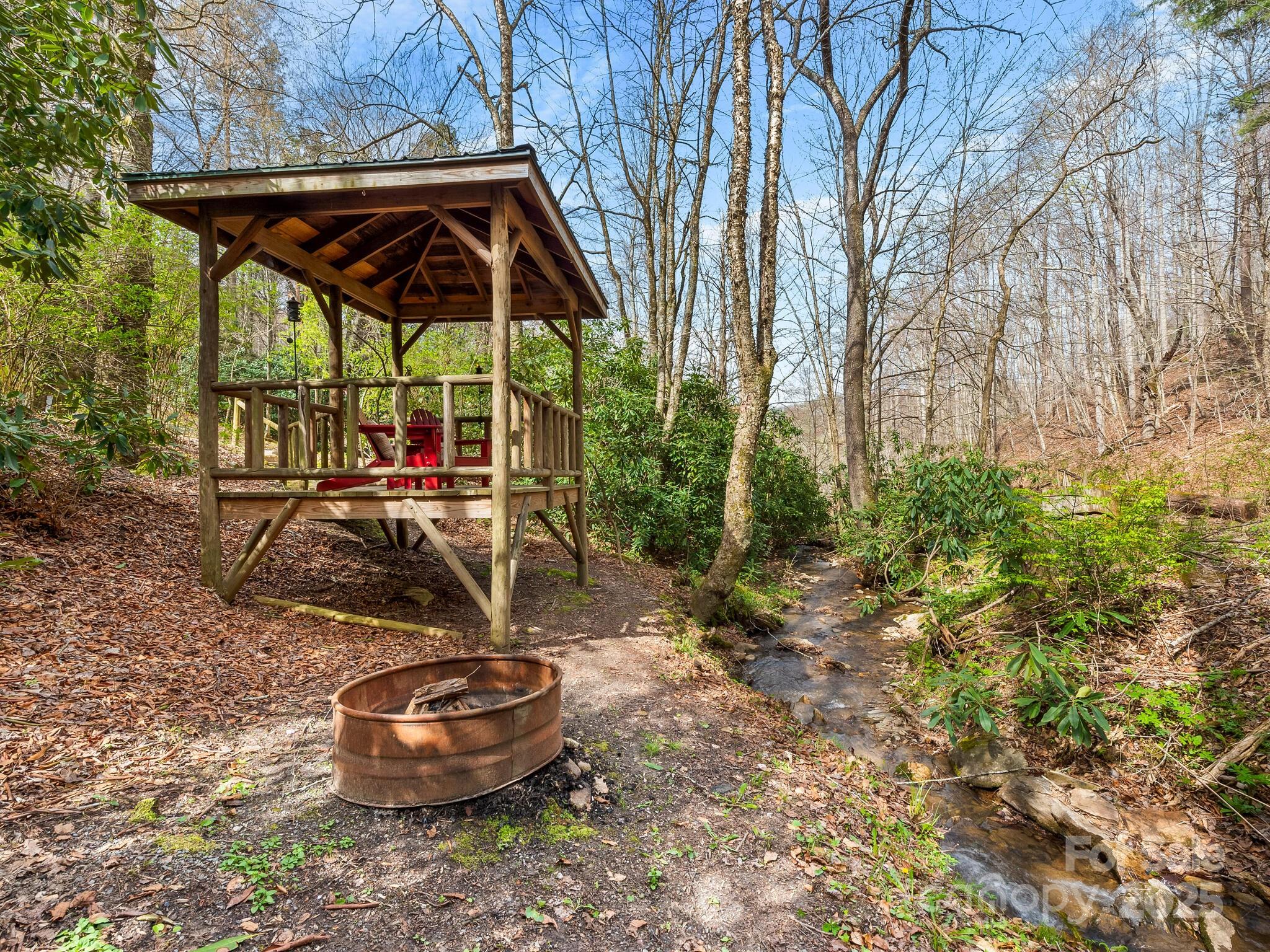 70 Fox Run Hot Springs, NC 28743 - Photo 29 of 29 a view of a patio with table and chairs under an umbrella