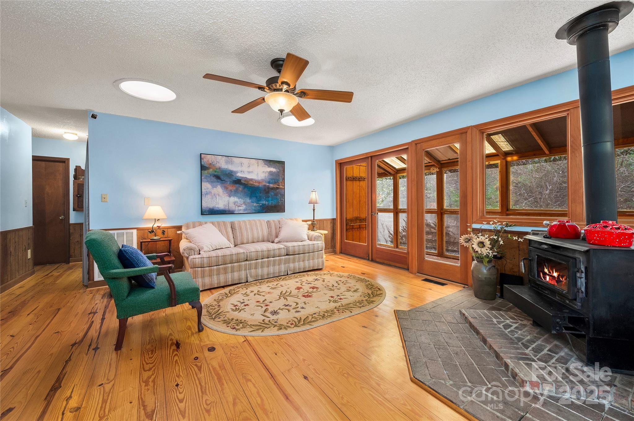 70 Fox Run Hot Springs, NC 28743 - Photo 4 of 29 a living room with furniture and a floor to ceiling window