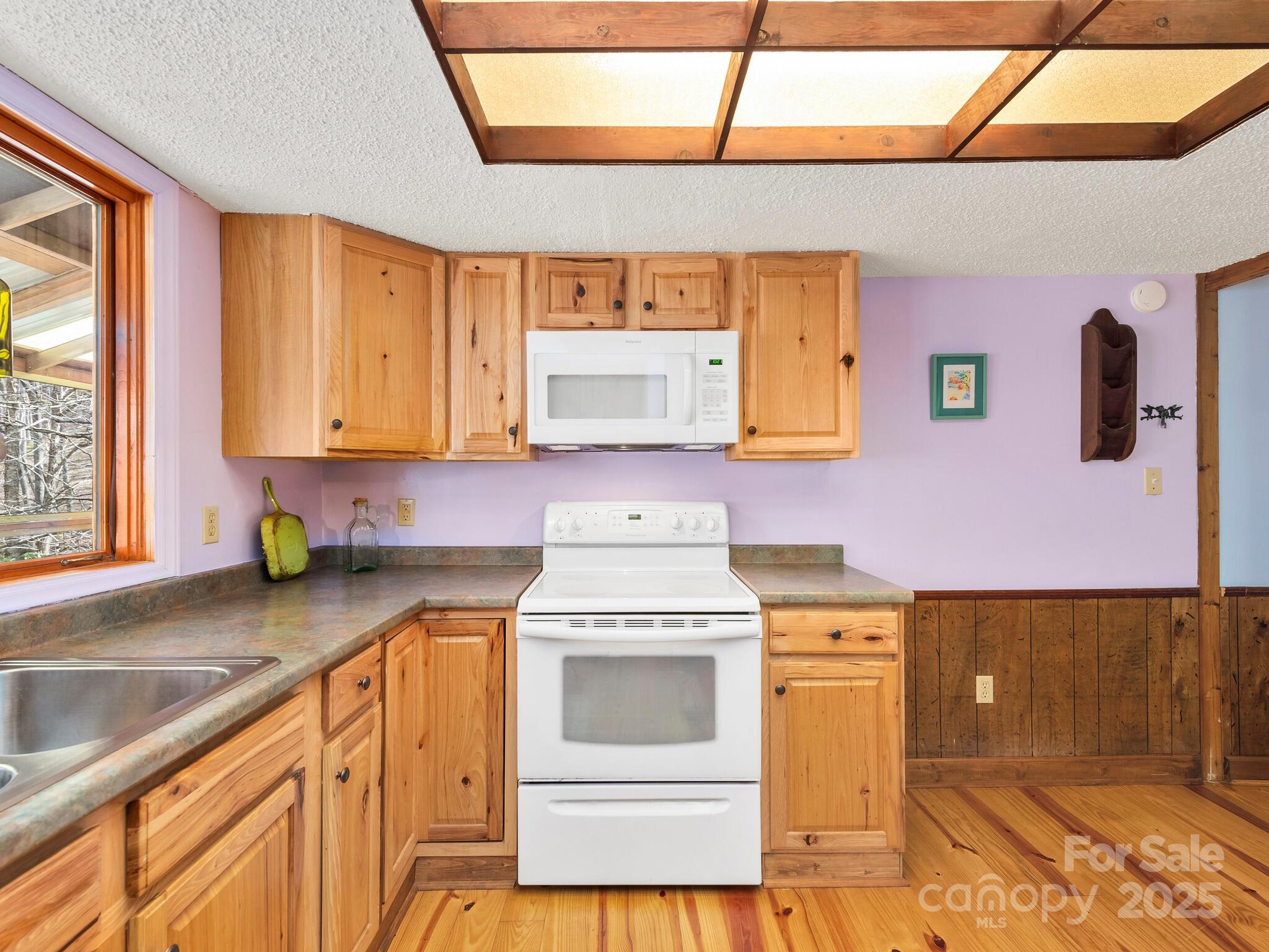 70 Fox Run Hot Springs, NC 28743 - Photo 8 of 29 a kitchen with a sink stove and cabinets