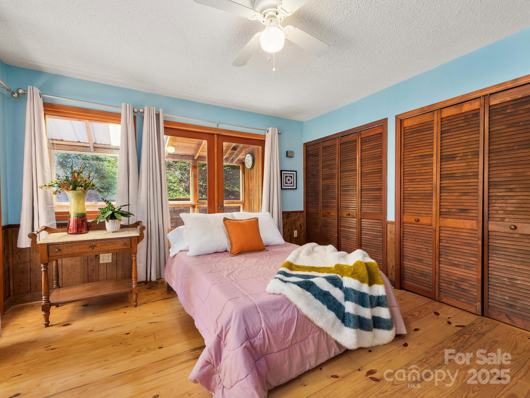 70 Fox Run Hot Springs, NC 28743 - Photo 9 of 29 a bedroom with a bed and wooden floor