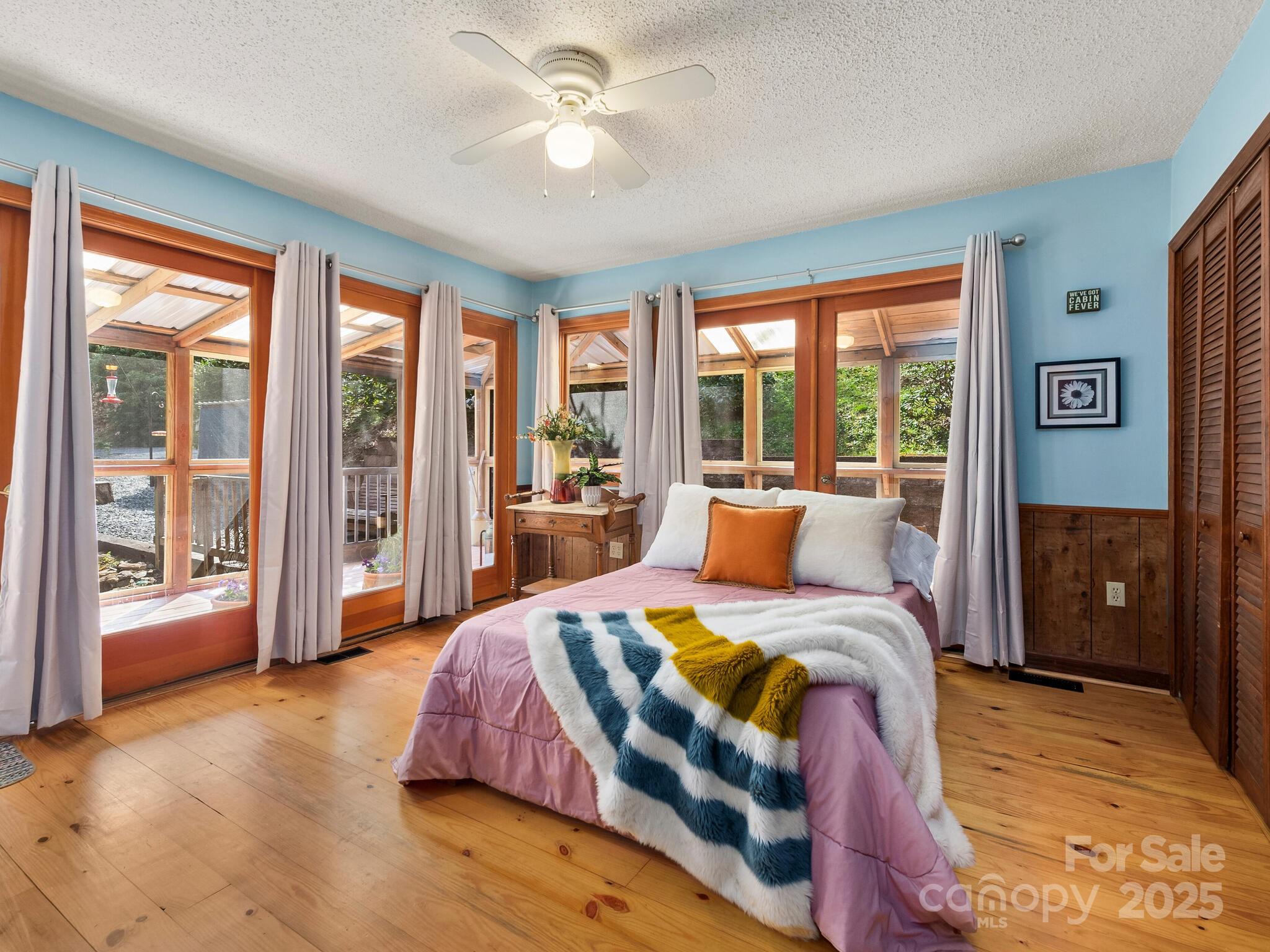 70 Fox Run Hot Springs, NC 28743 - Photo 10 of 29 a bedroom with a large bed and a large window
