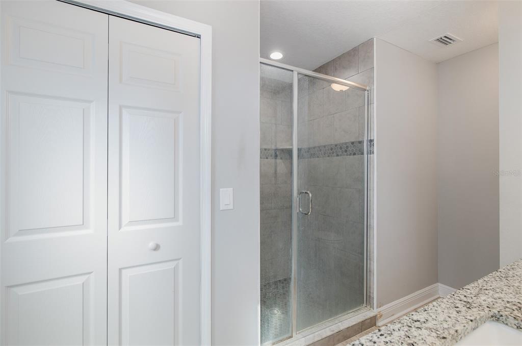 6823 Crossbow Lane New Port Richey, FL 34653 - Photo 14 of 25 a bathroom with a shower