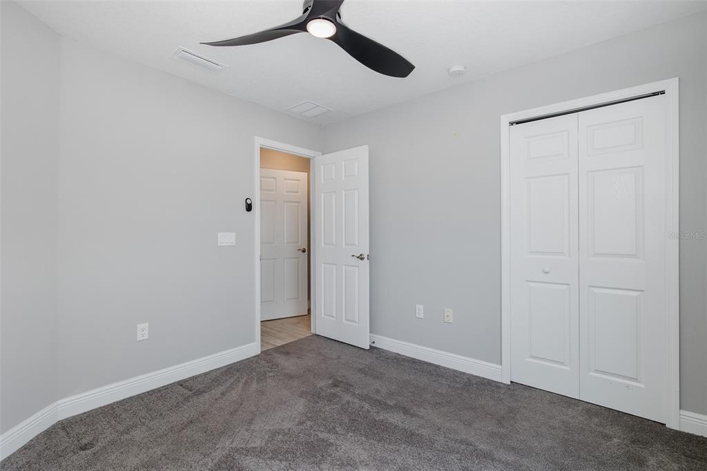 6823 Crossbow Lane New Port Richey, FL 34653 - Photo 17 of 25 an empty room with a empty space and windows