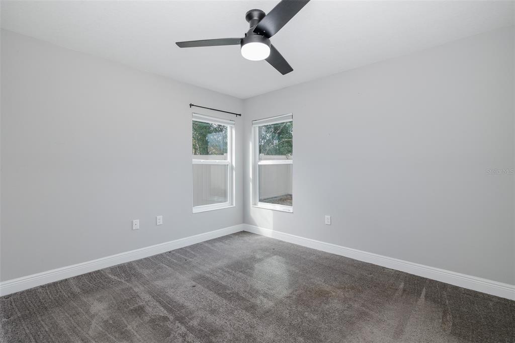 6823 Crossbow Lane New Port Richey, FL 34653 - Photo 20 of 25 a view of an empty room with a window