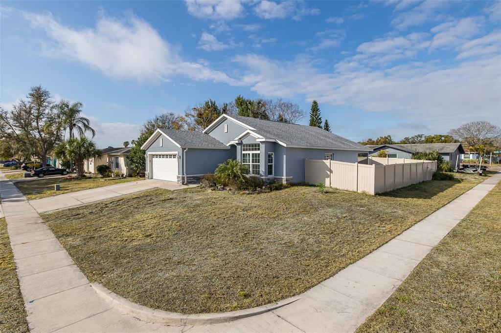6823 Crossbow Lane New Port Richey, FL 34653 - Photo 2 of 25 a view of a house with entertaining space