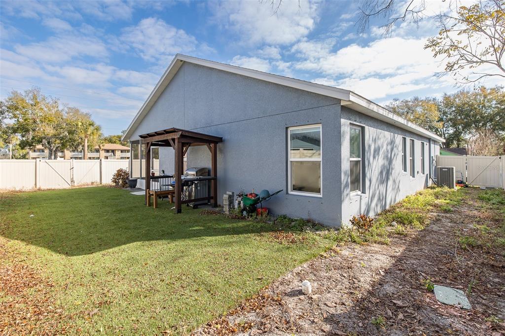 6823 Crossbow Lane New Port Richey, FL 34653 - Photo 22 of 25 a house view with a garden space