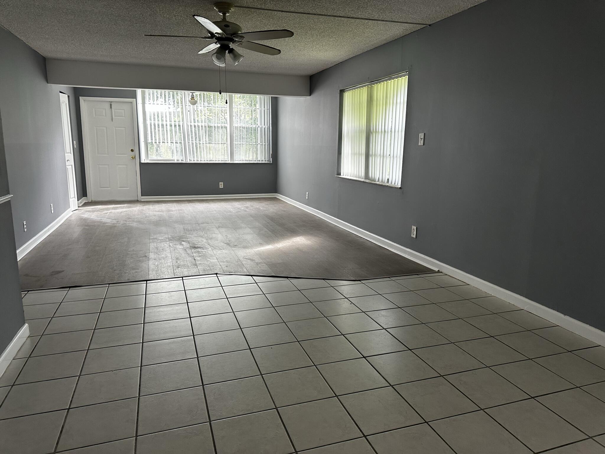 2940 Southwest 22nd Avenue, Unit 7170 Delray Beach, FL 33445 - Photo 4 of 9 a view of an empty room and window