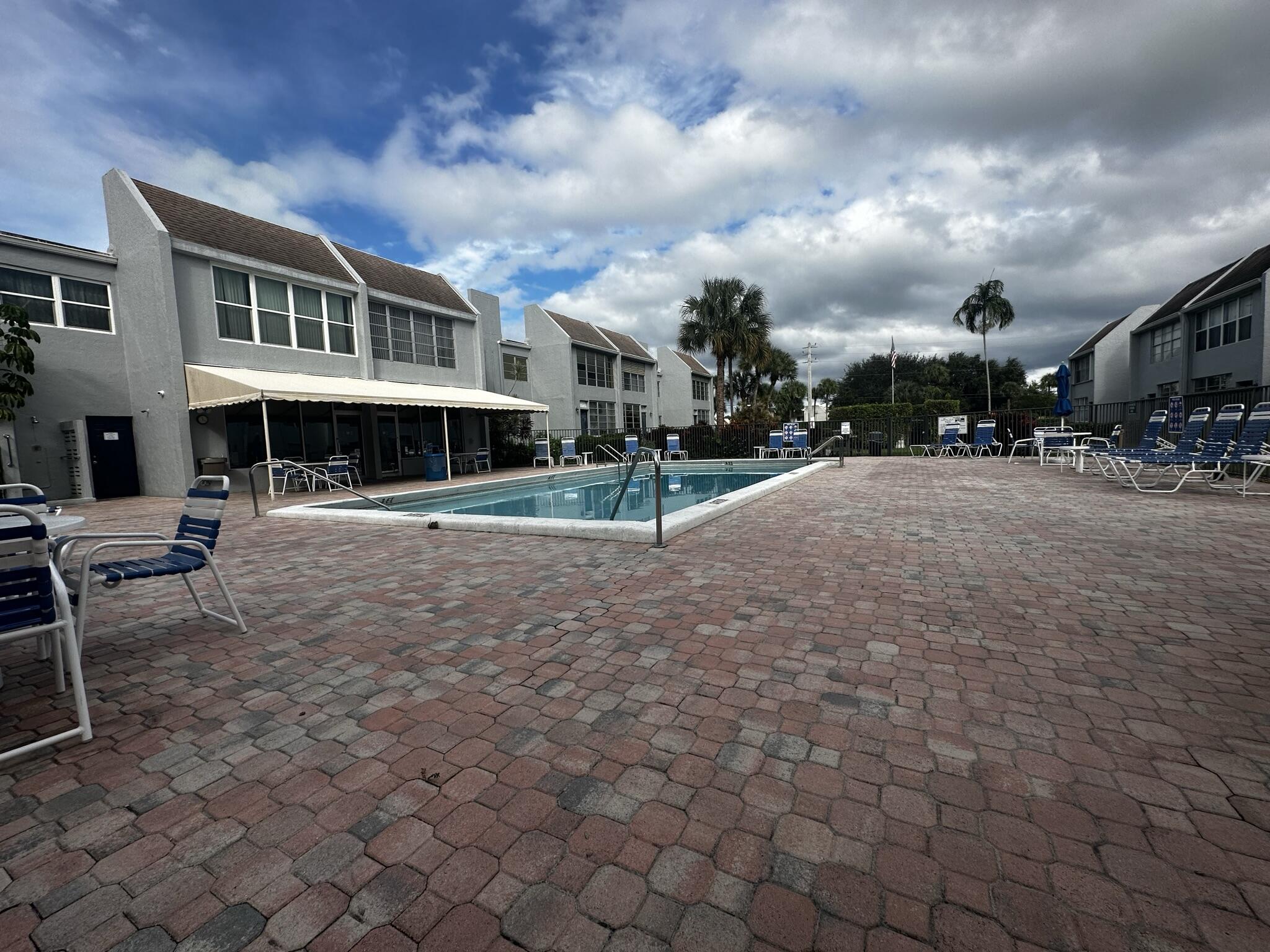 2940 Southwest 22nd Avenue, Unit 7170 Delray Beach, FL 33445 - Photo 9 of 9 a view of a town with brick building and many windows
