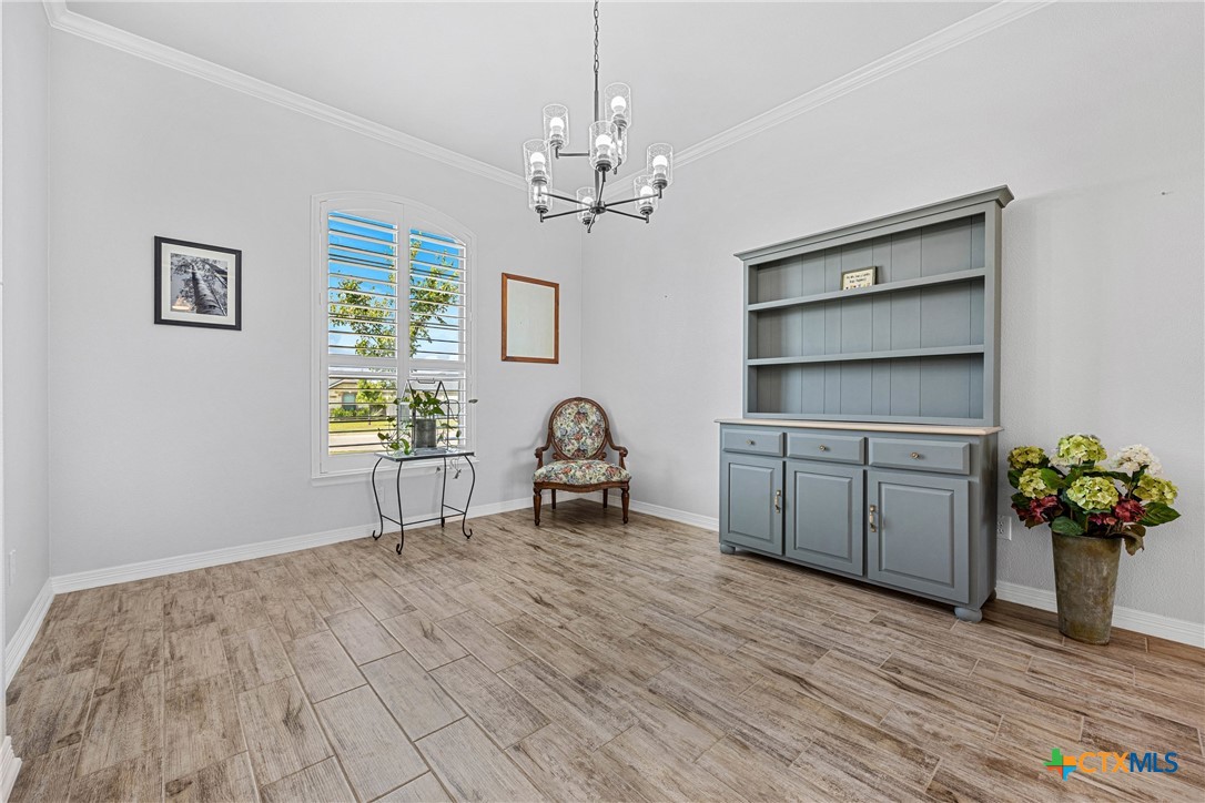 5513 Hollow Loop Salado, TX 76571 - Photo 6 of 37 a view of a workspace with furniture and a chandelier