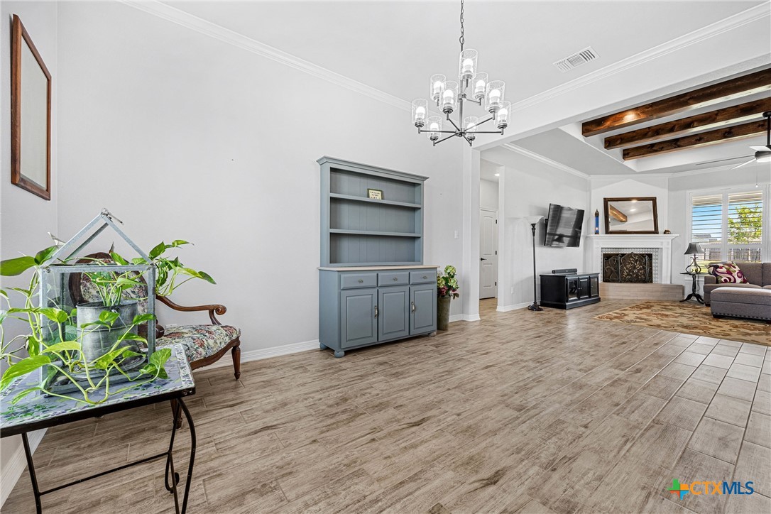 5513 Hollow Loop Salado, TX 76571 - Photo 7 of 37 a living room with furniture and a chandelier