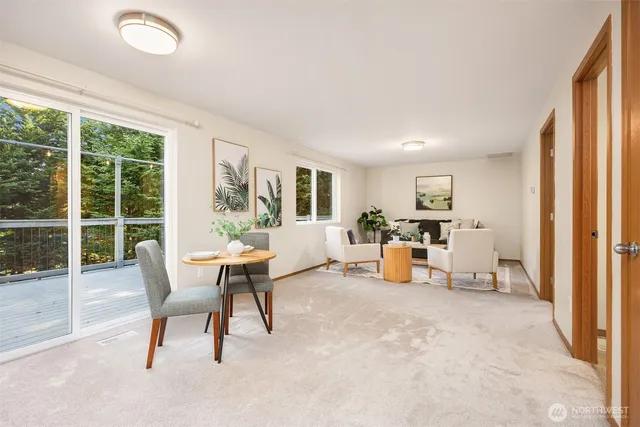 a view of a livingroom with furniture and a window