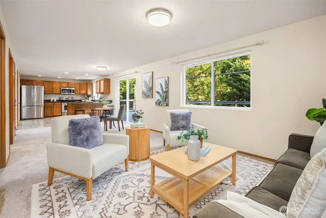 a living room with furniture and a large window