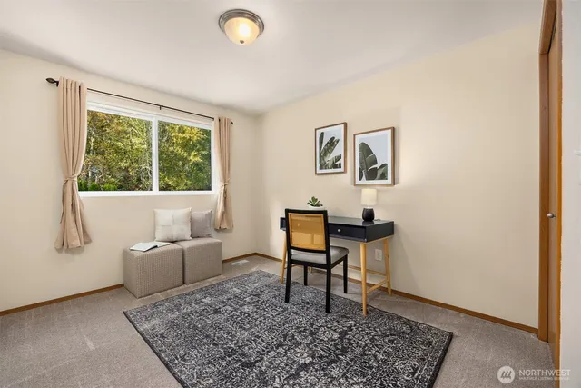 a living room with a couch and a window