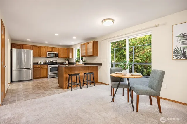 a kitchen with a table and chairs