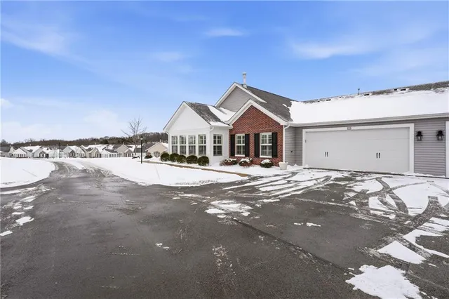 a view of house with yard