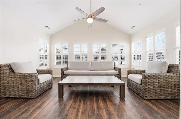 a living room with furniture and a rug