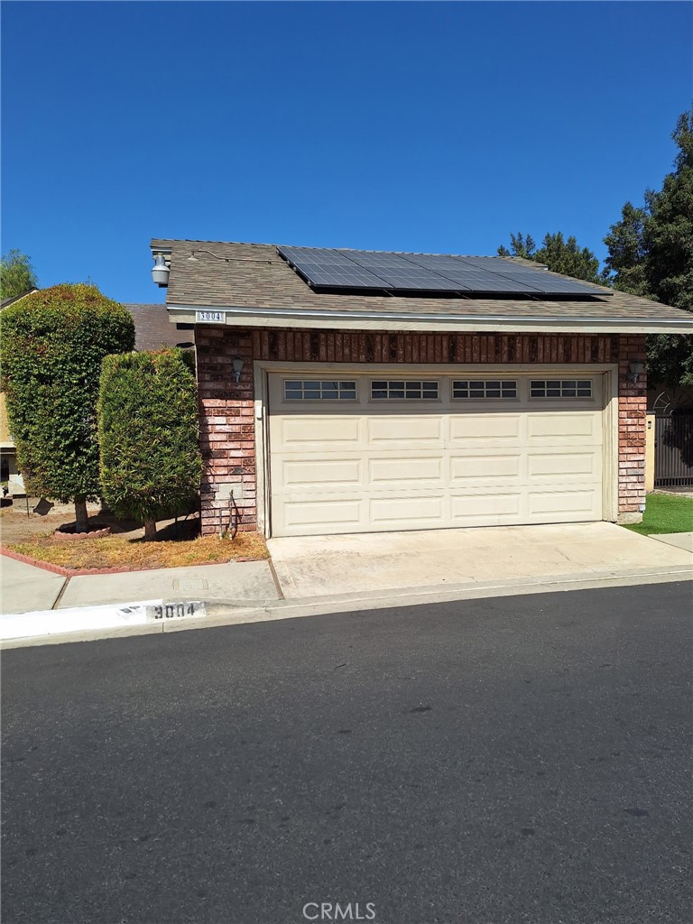a view of a house with a parking space