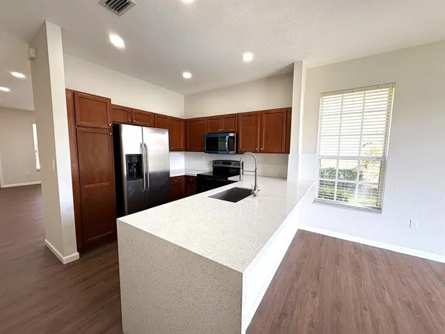 a view of a lake with a yard