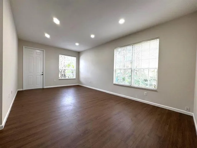a view of hallway with wooden floor