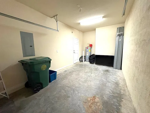 an empty room with wooden floor and closet area