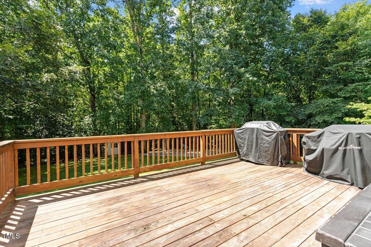 5112 Solemn Grove Road Garner, NC 27529 - Photo 11 of 56 a view of wooden deck and a yard