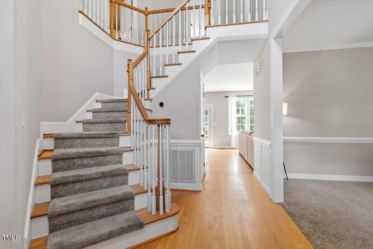 5112 Solemn Grove Road Garner, NC 27529 - Photo 13 of 56 a view of entryway and hall with wooden floor