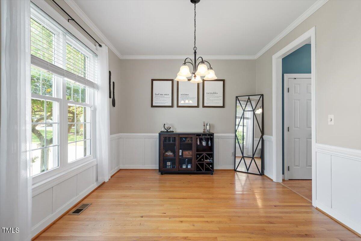 5112 Solemn Grove Road Garner, NC 27529 - Photo 25 of 56 a view of a room with wooden floor closet and windows