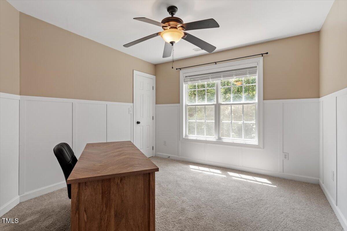 5112 Solemn Grove Road Garner, NC 27529 - Photo 31 of 56 a view of a dining room with furniture and a chandelier fan