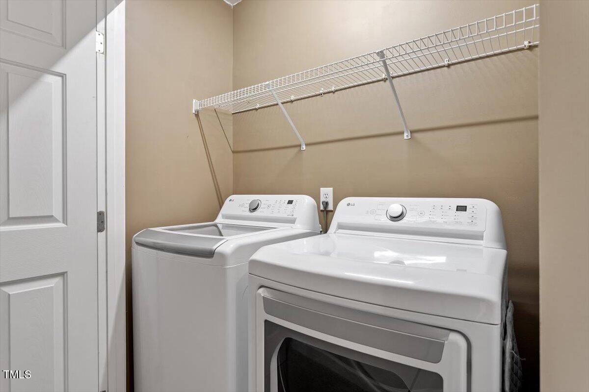 5112 Solemn Grove Road Garner, NC 27529 - Photo 34 of 56 a utility room with dryer and washer