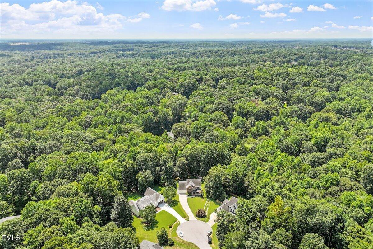 5112 Solemn Grove Road Garner, NC 27529 - Photo 38 of 56 an aerial view of residential houses with outdoor space and trees