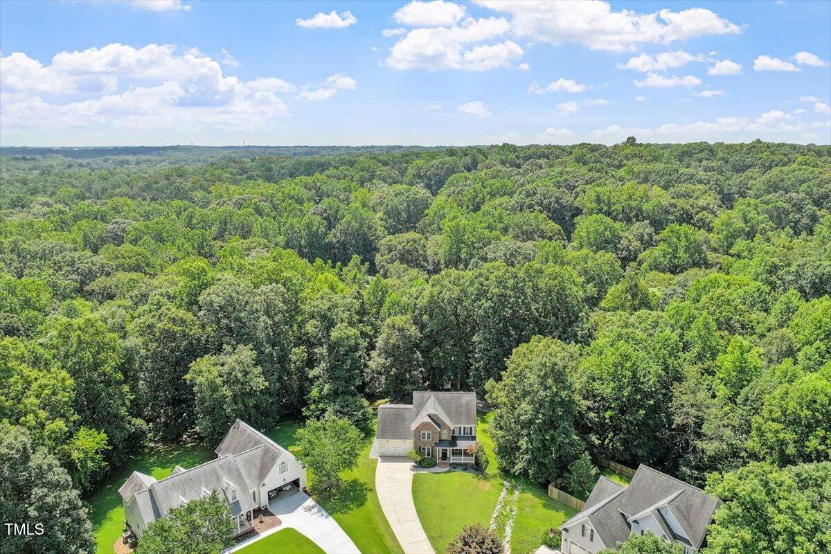 5112 Solemn Grove Road Garner, NC 27529 - Photo 39 of 56 an aerial view of a house with yard and mountain view in back