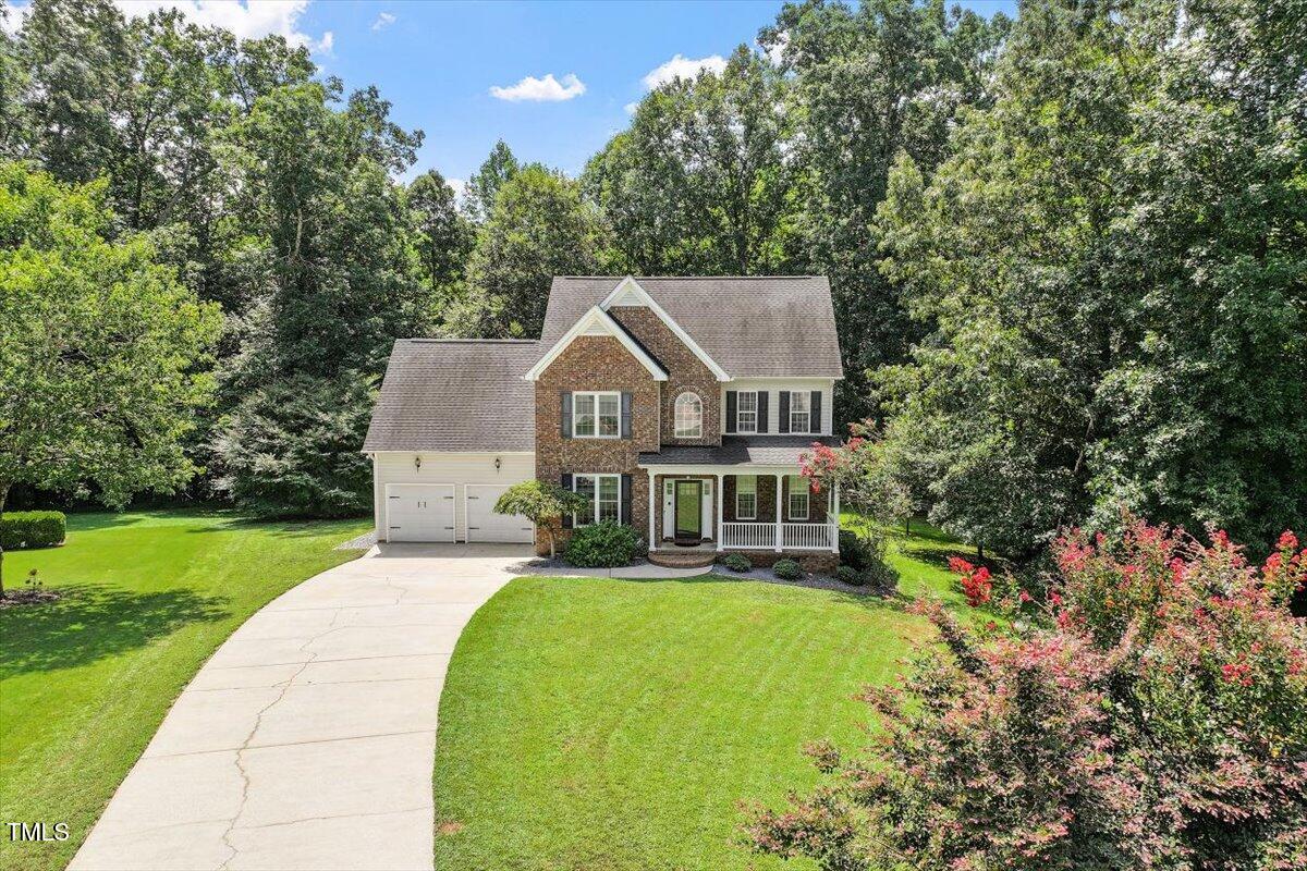 5112 Solemn Grove Road Garner, NC 27529 - Photo 42 of 56 a front view of a house with yard and green space