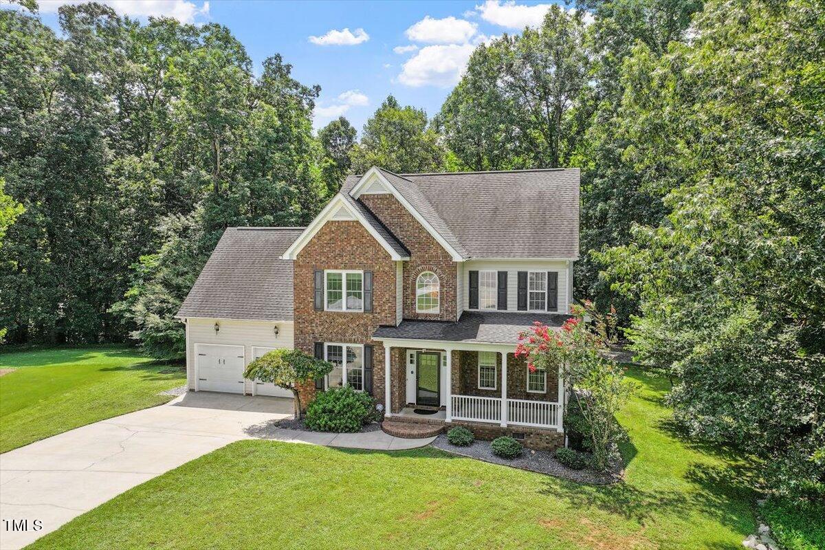 5112 Solemn Grove Road Garner, NC 27529 - Photo 43 of 56 a front view of a house with a yard