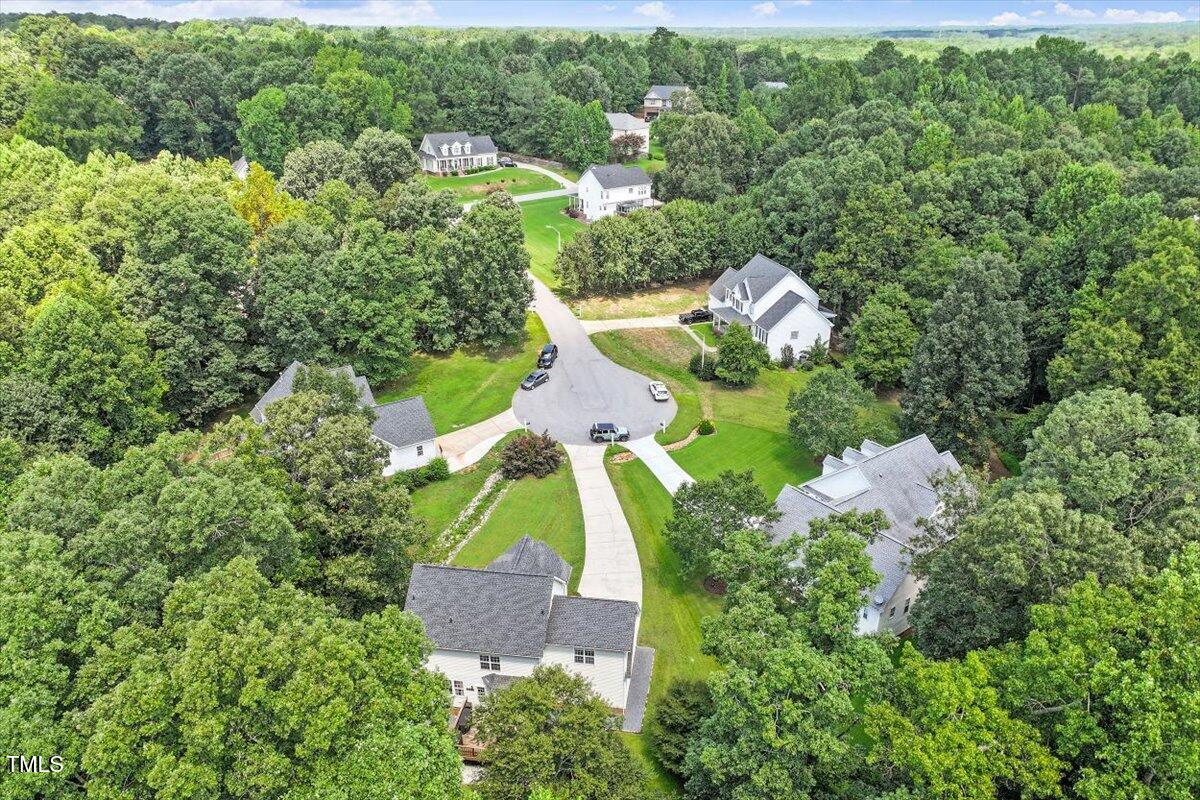 5112 Solemn Grove Road Garner, NC 27529 - Photo 46 of 56 an aerial view of residential house with outdoor space and trees all around