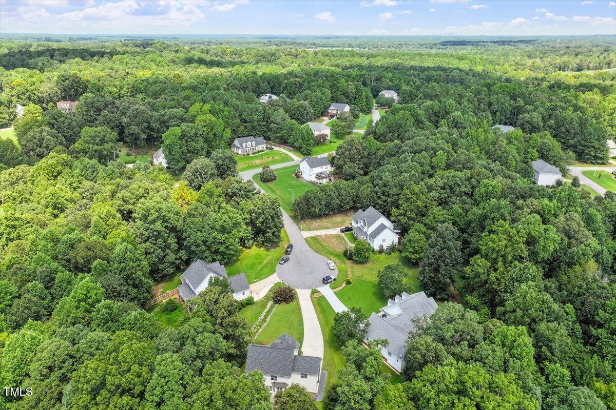 5112 Solemn Grove Road Garner, NC 27529 - Photo 47 of 56 an aerial view of a house with a yard