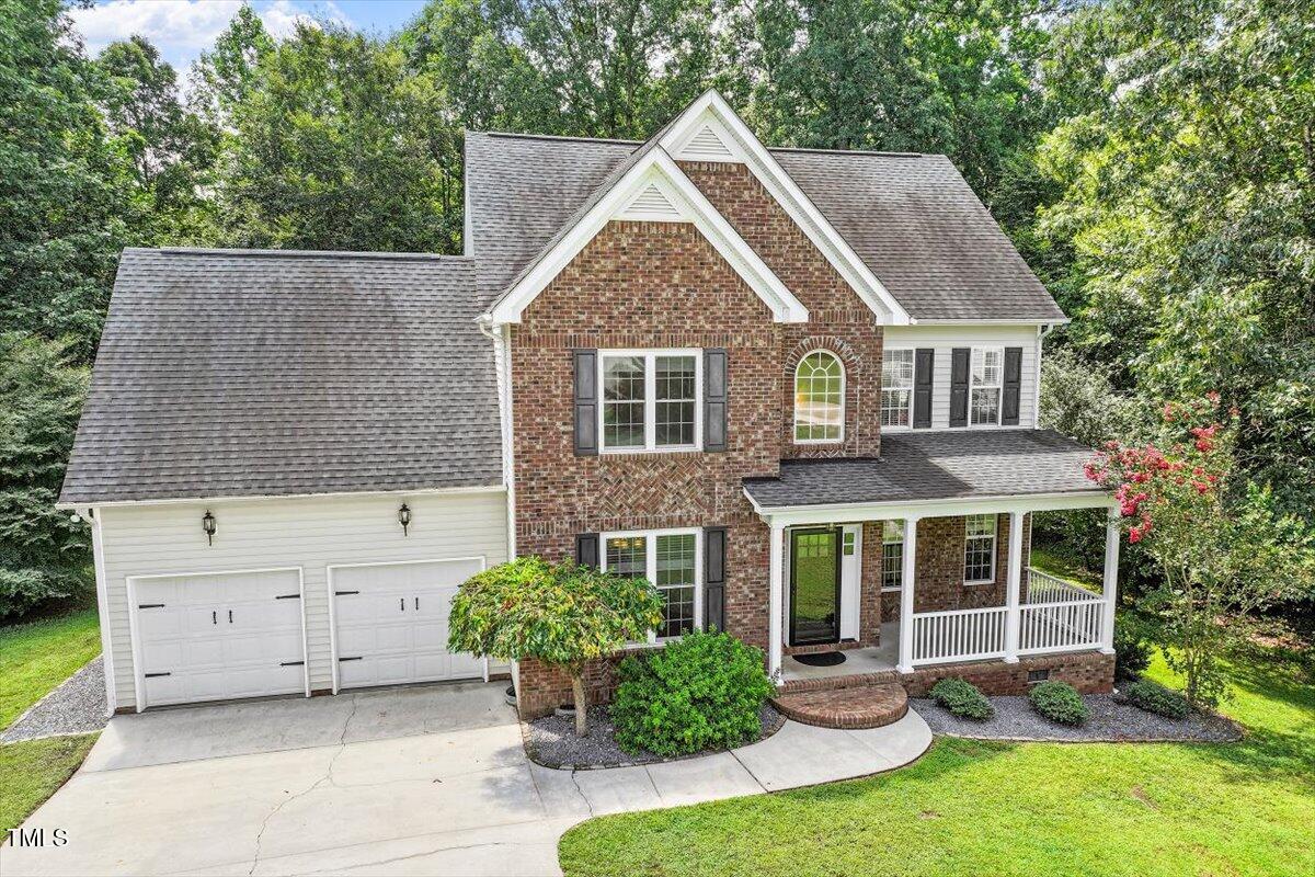 5112 Solemn Grove Road Garner, NC 27529 - Photo 48 of 56 front view of a house with a yard
