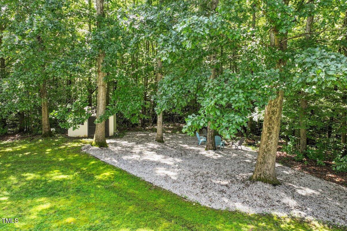 5112 Solemn Grove Road Garner, NC 27529 - Photo 53 of 56 a view of a backyard with trees