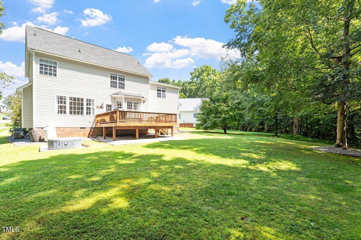 5112 Solemn Grove Road Garner, NC 27529 - Photo 8 of 56 a front view of a house with garden