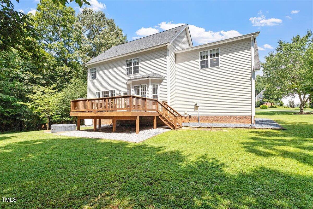 5112 Solemn Grove Road Garner, NC 27529 - Photo 10 of 56 a view of a house with a yard patio and sitting area