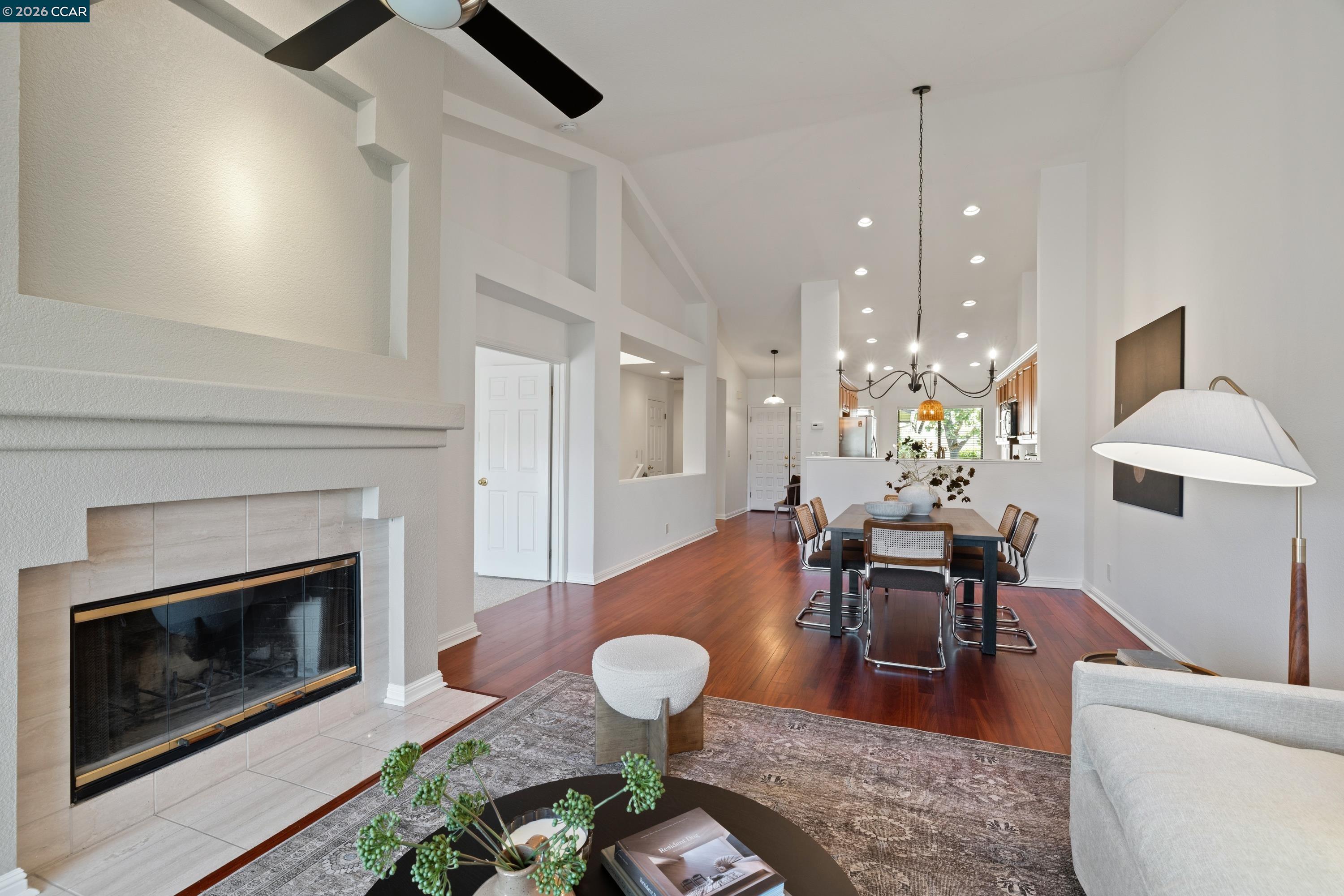 467 Beacon Ridge Lane Walnut Creek, CA 94597 - Photo 14 of 48 a living room with furniture potted plant and a fireplace