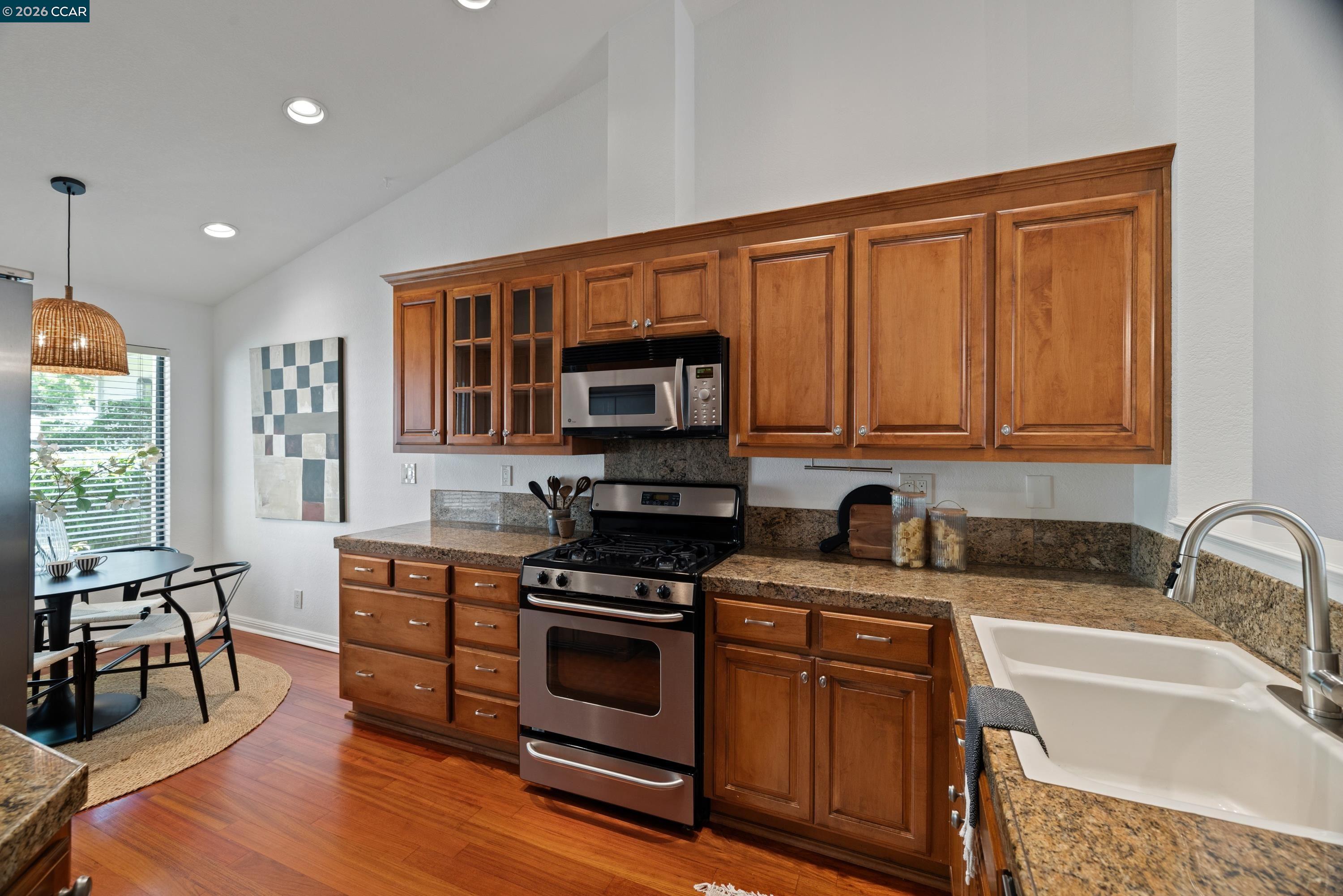 467 Beacon Ridge Lane Walnut Creek, CA 94597 - Photo 16 of 48 a kitchen with stainless steel appliances granite countertop a stove microwave and sink