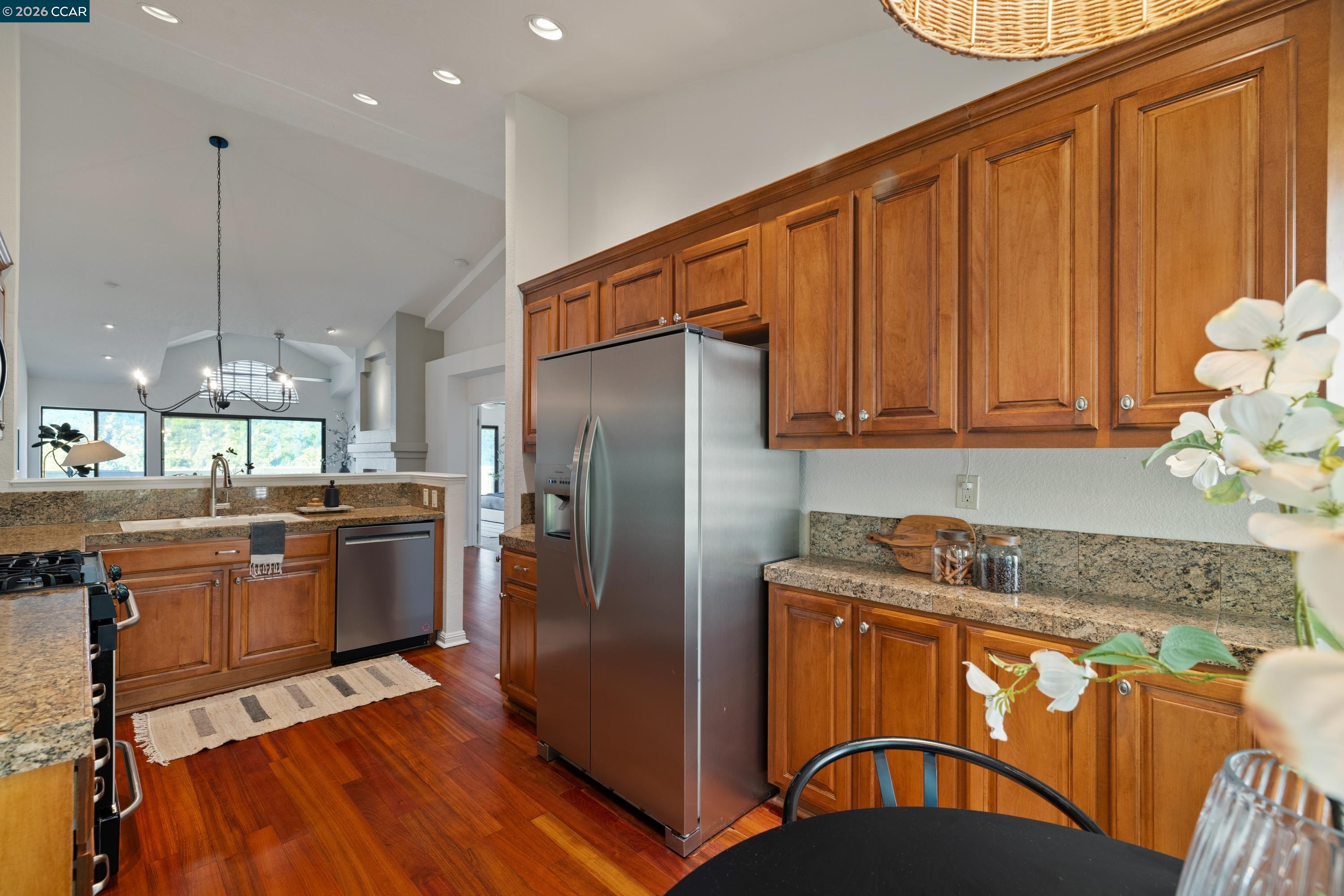 467 Beacon Ridge Lane Walnut Creek, CA 94597 - Photo 18 of 48 a kitchen with stainless steel appliances granite countertop a refrigerator a stove a sink and a wooden cabinets