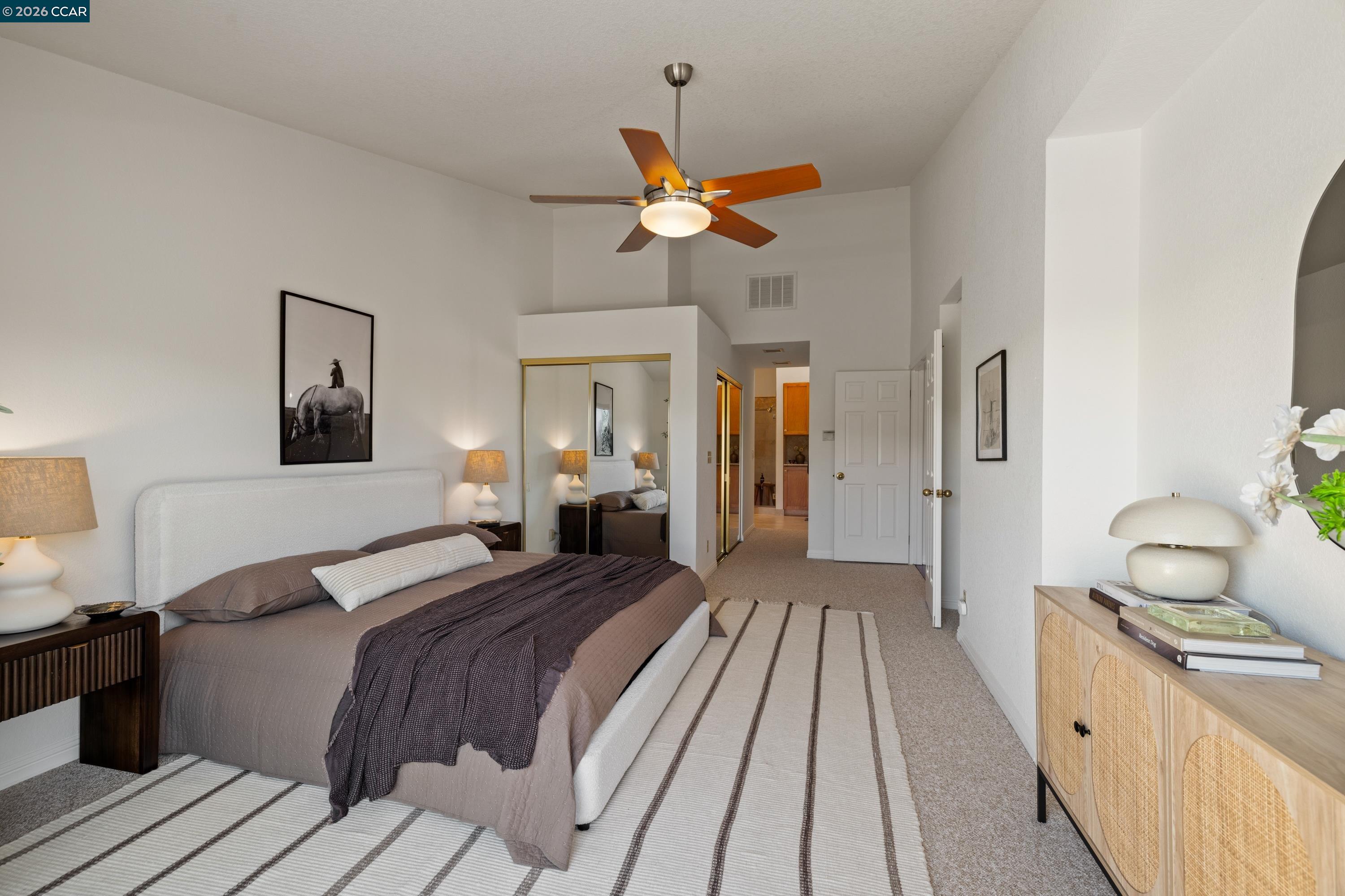 467 Beacon Ridge Lane Walnut Creek, CA 94597 - Photo 22 of 48 a bedroom with a bed and a chandelier
