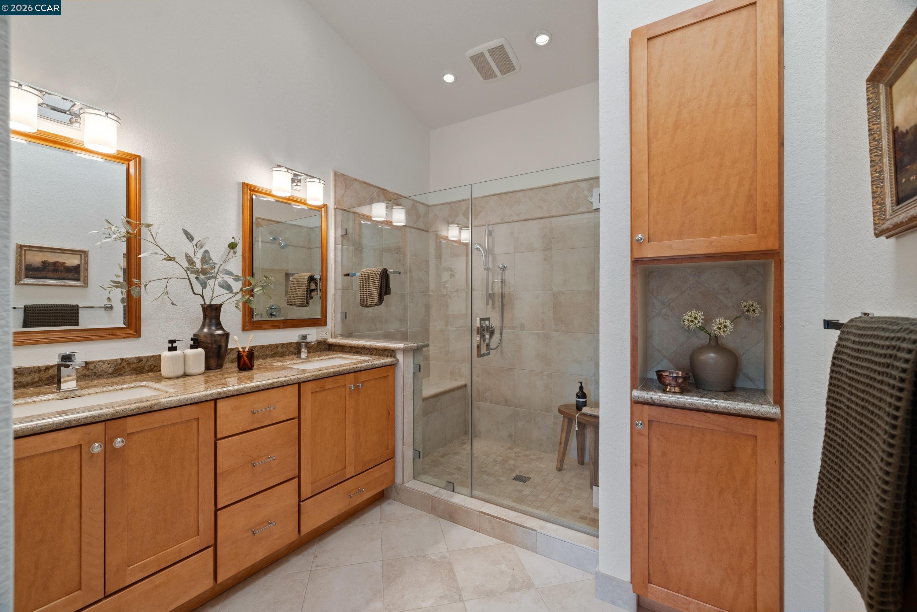 467 Beacon Ridge Lane Walnut Creek, CA 94597 - Photo 23 of 48 a bathroom with a double vanity sink and mirror