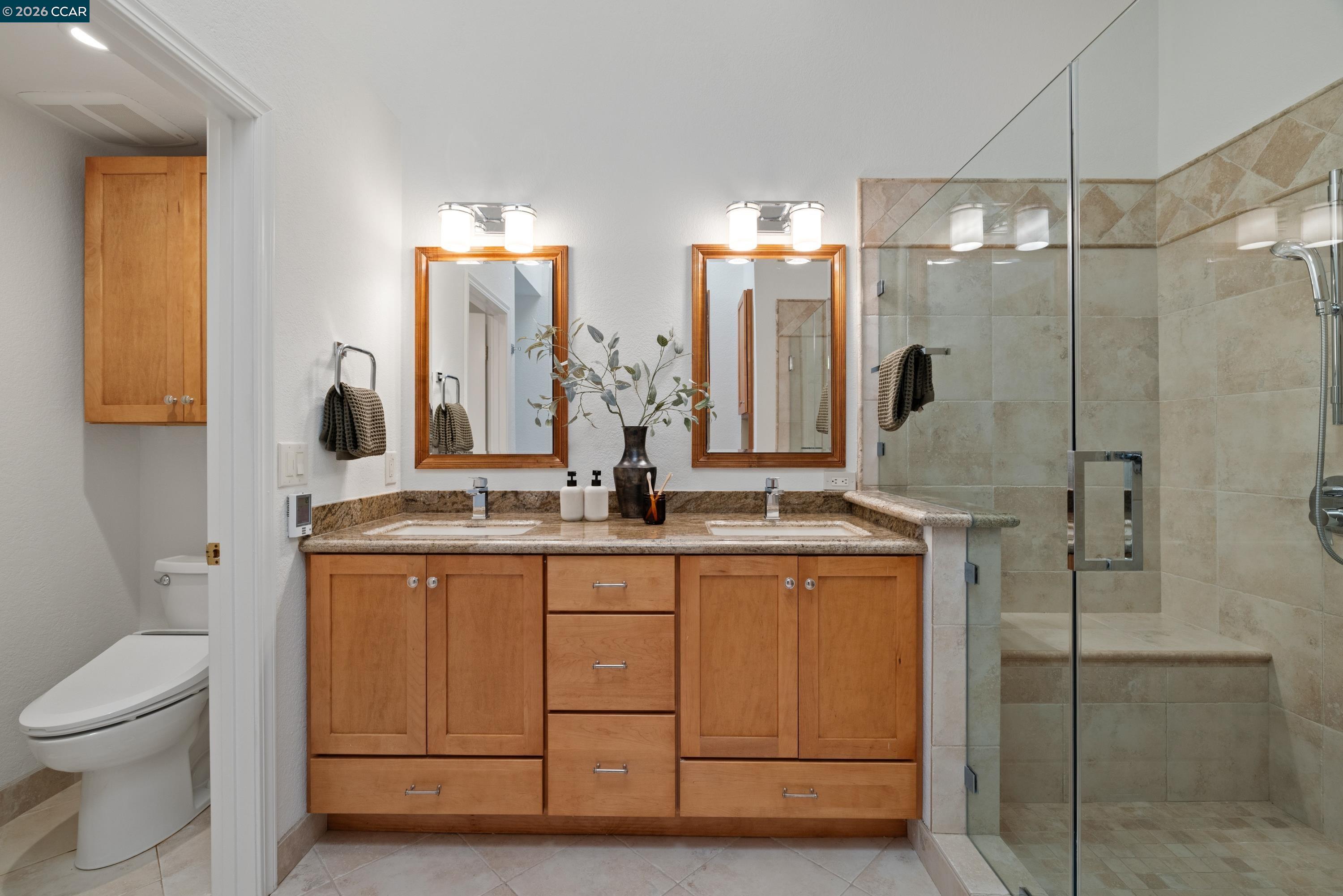467 Beacon Ridge Lane Walnut Creek, CA 94597 - Photo 24 of 48 a bathroom with a granite countertop sink a toilet and a mirror