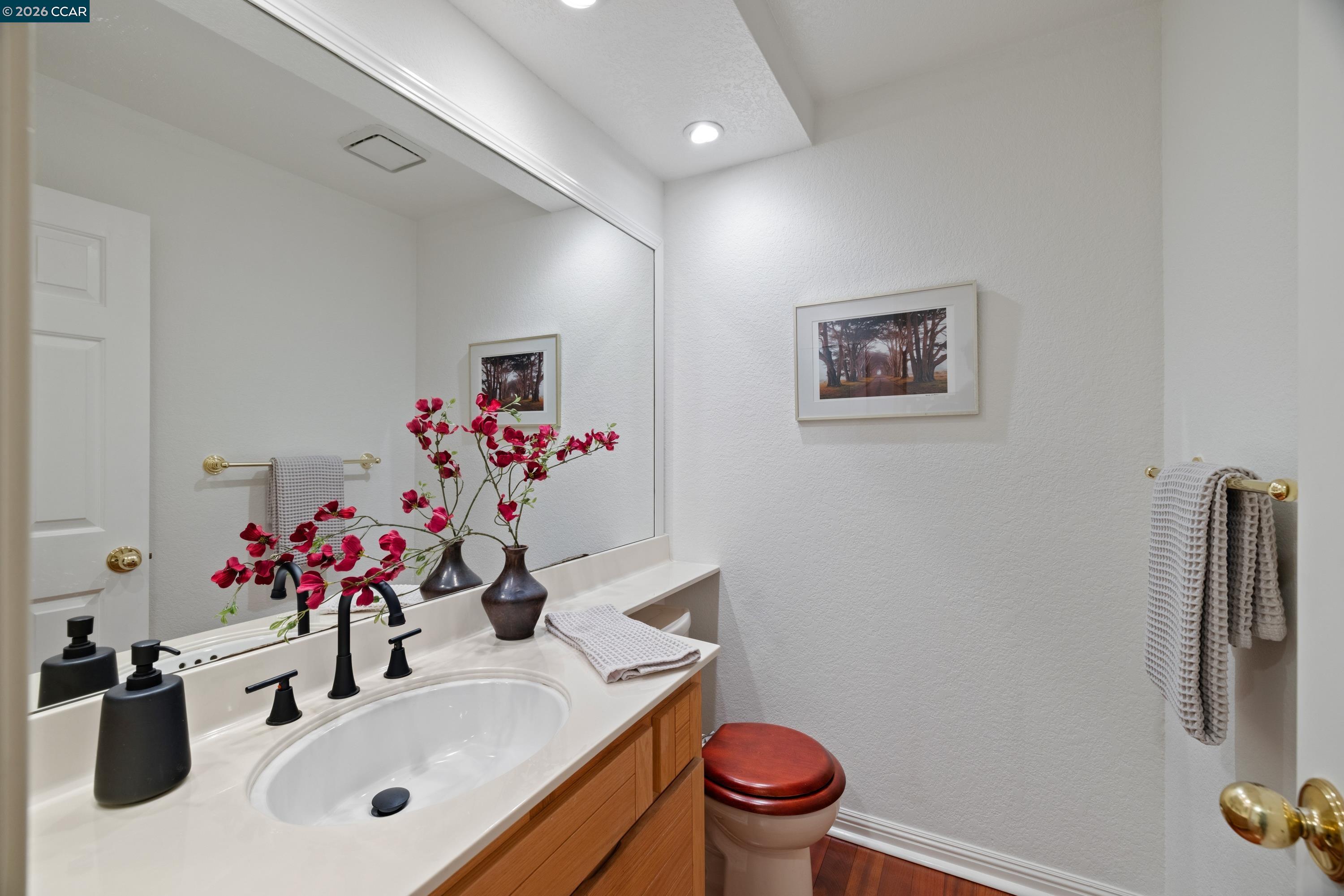 467 Beacon Ridge Lane Walnut Creek, CA 94597 - Photo 25 of 48 a bathroom with a sink vanity mirror and toilet