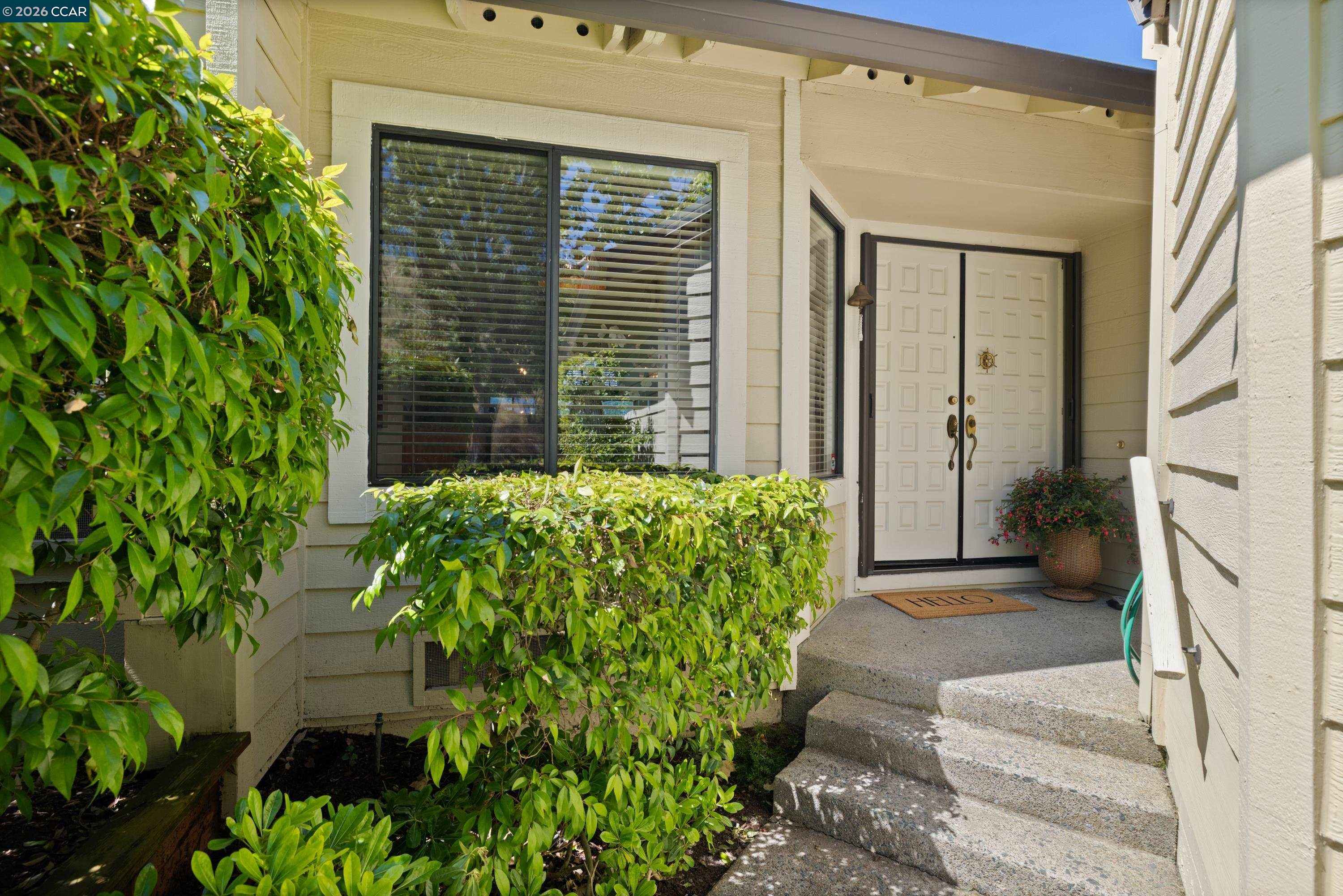 467 Beacon Ridge Lane Walnut Creek, CA 94597 - Photo 3 of 48 a front view of a house with garden