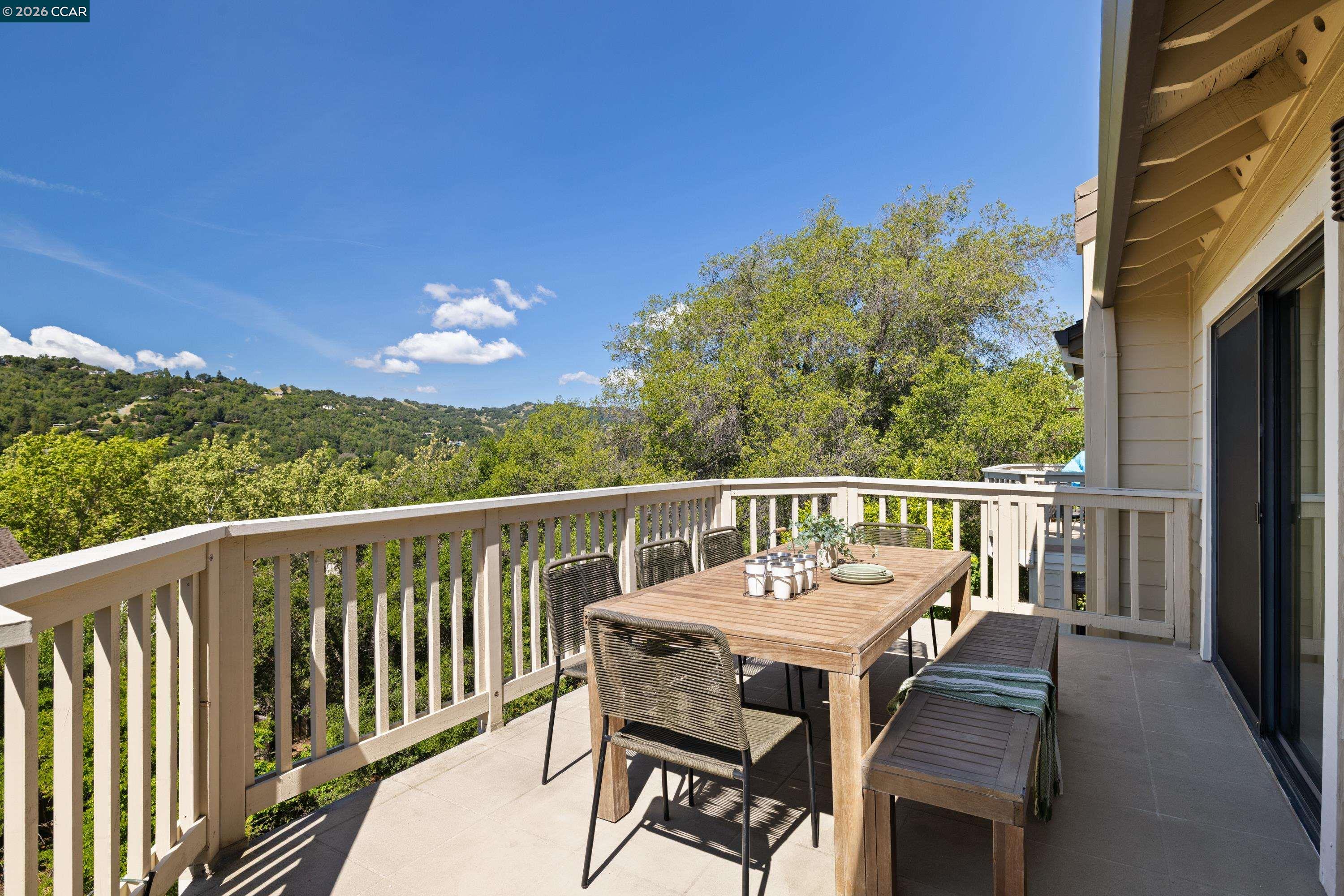 467 Beacon Ridge Lane Walnut Creek, CA 94597 - Photo 32 of 48 a view of a balcony with wooden floor and outdoor seating